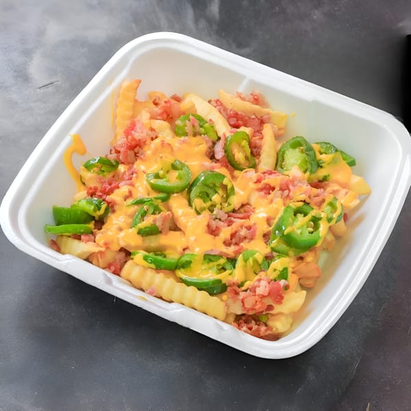 Anthony's Pizza loaded fries with melted cheese, bacon bits, and sliced jalapeños in a white container.